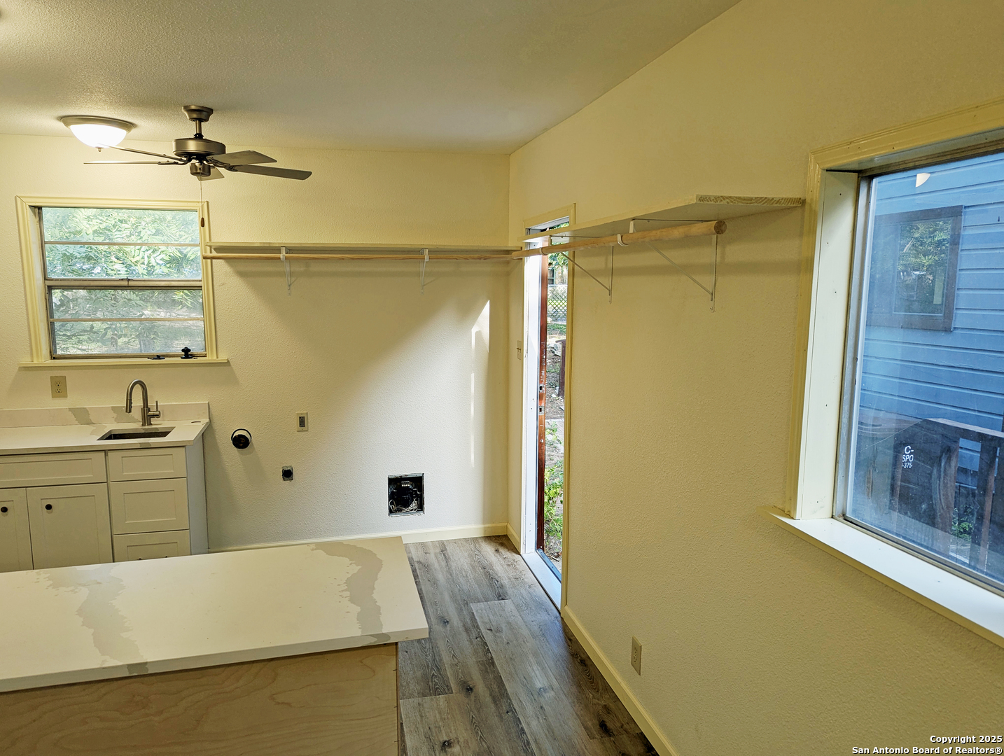 19517 Scenic Loop Road Helotes, TX 78023 - Photo 35 of 55 a bathroom with a tub a sink and glass door