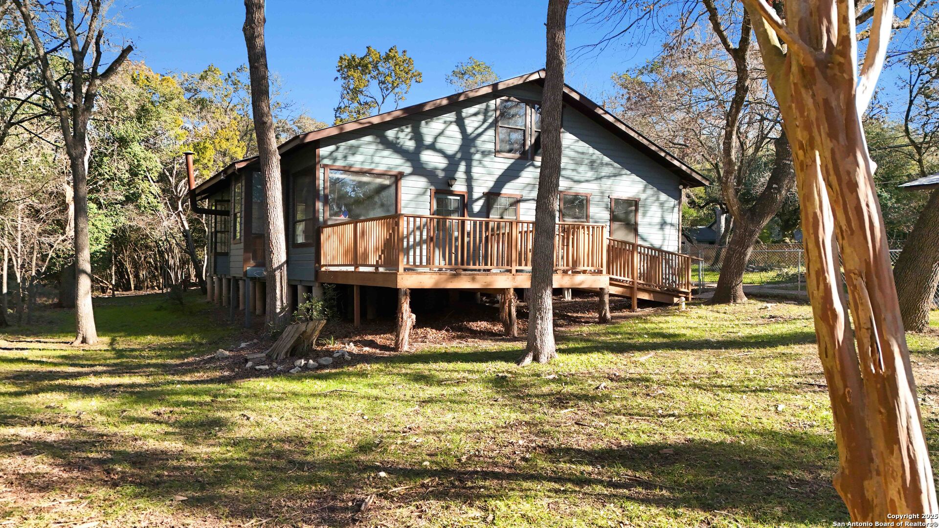 19517 Scenic Loop Road Helotes, TX 78023 - Photo 36 of 55 a view of a house with yard and sitting area