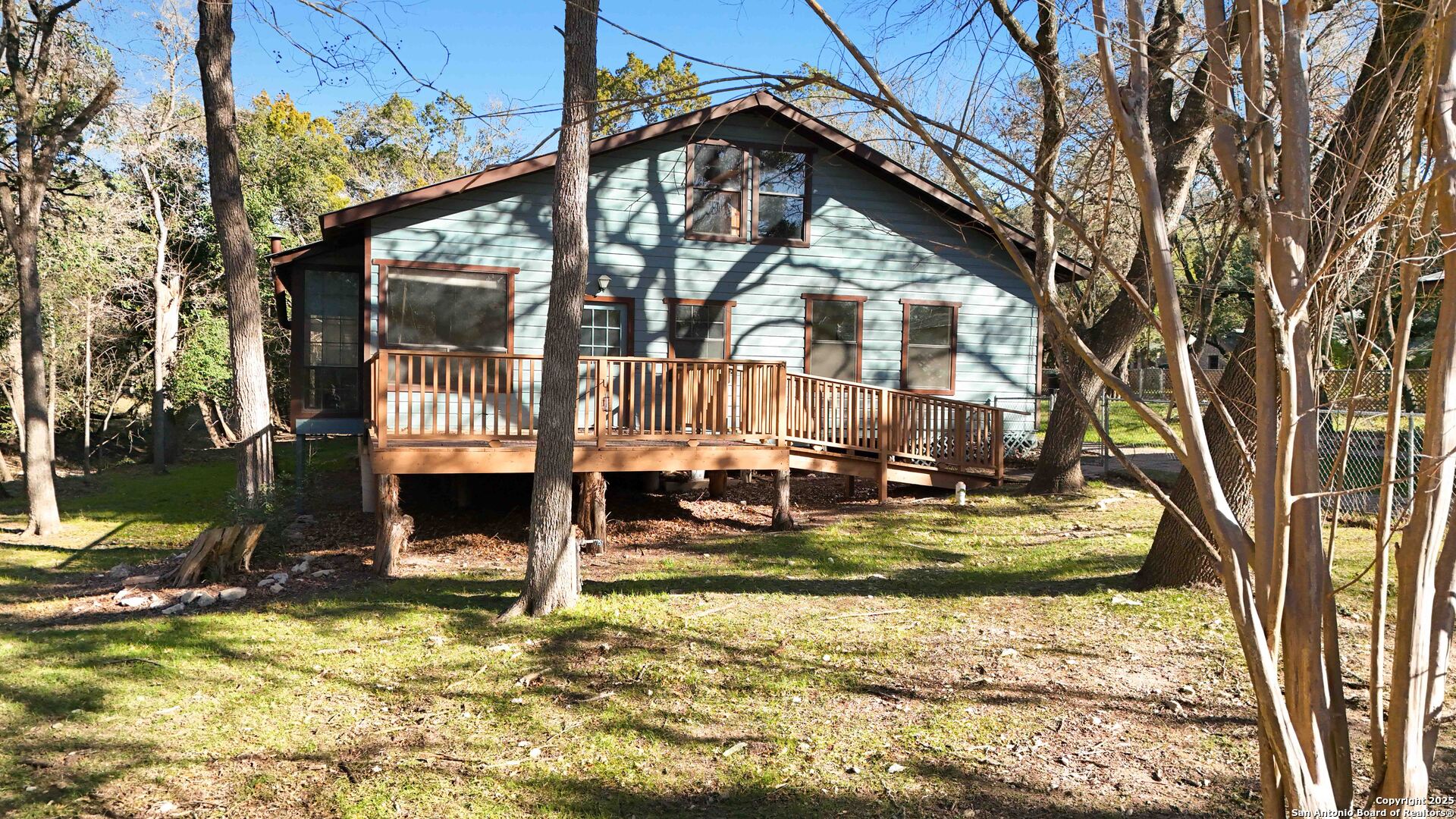 19517 Scenic Loop Road Helotes, TX 78023 - Photo 38 of 55 a view of a house with snow on the wall