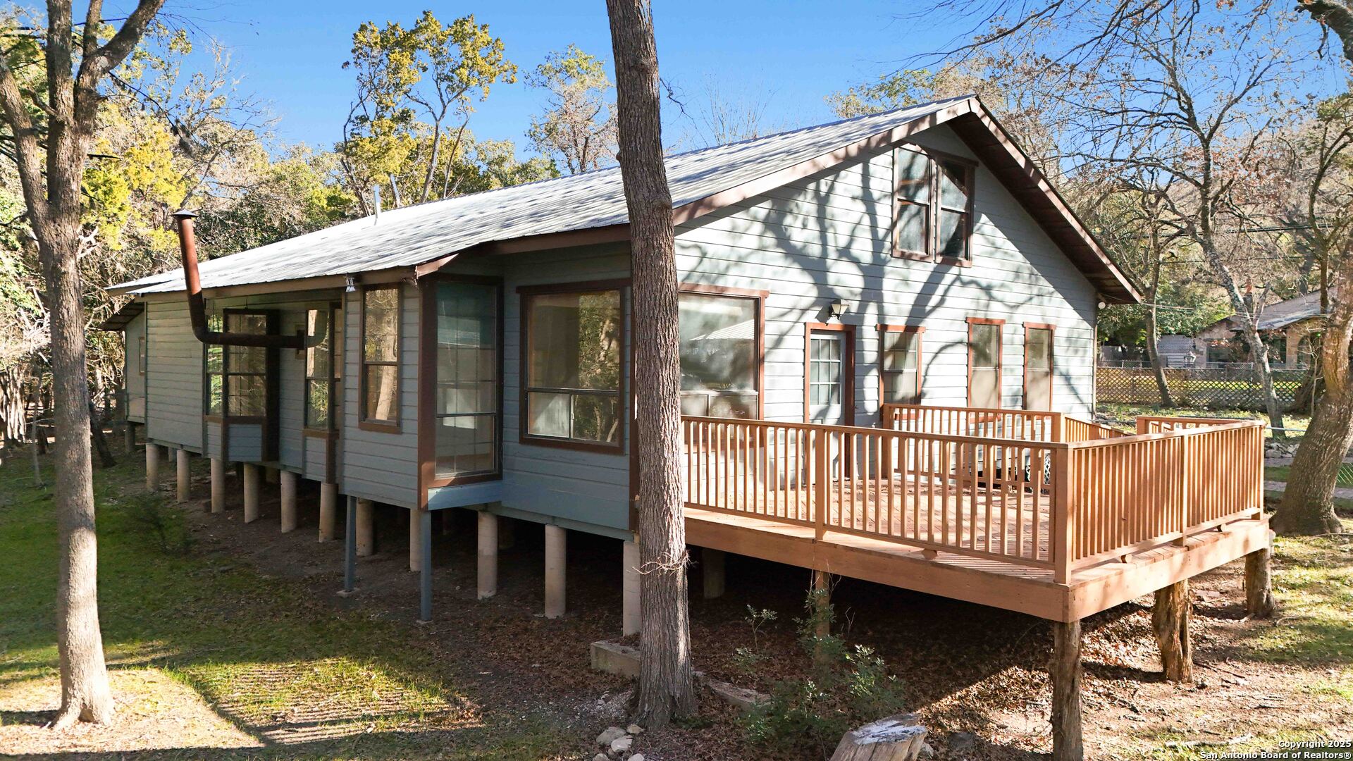 19517 Scenic Loop Road Helotes, TX 78023 - Photo 40 of 55 a view of a house with a yard
