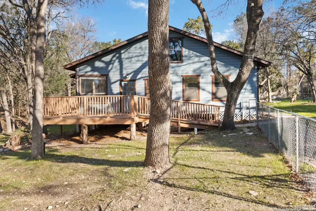 a view of yard with large trees