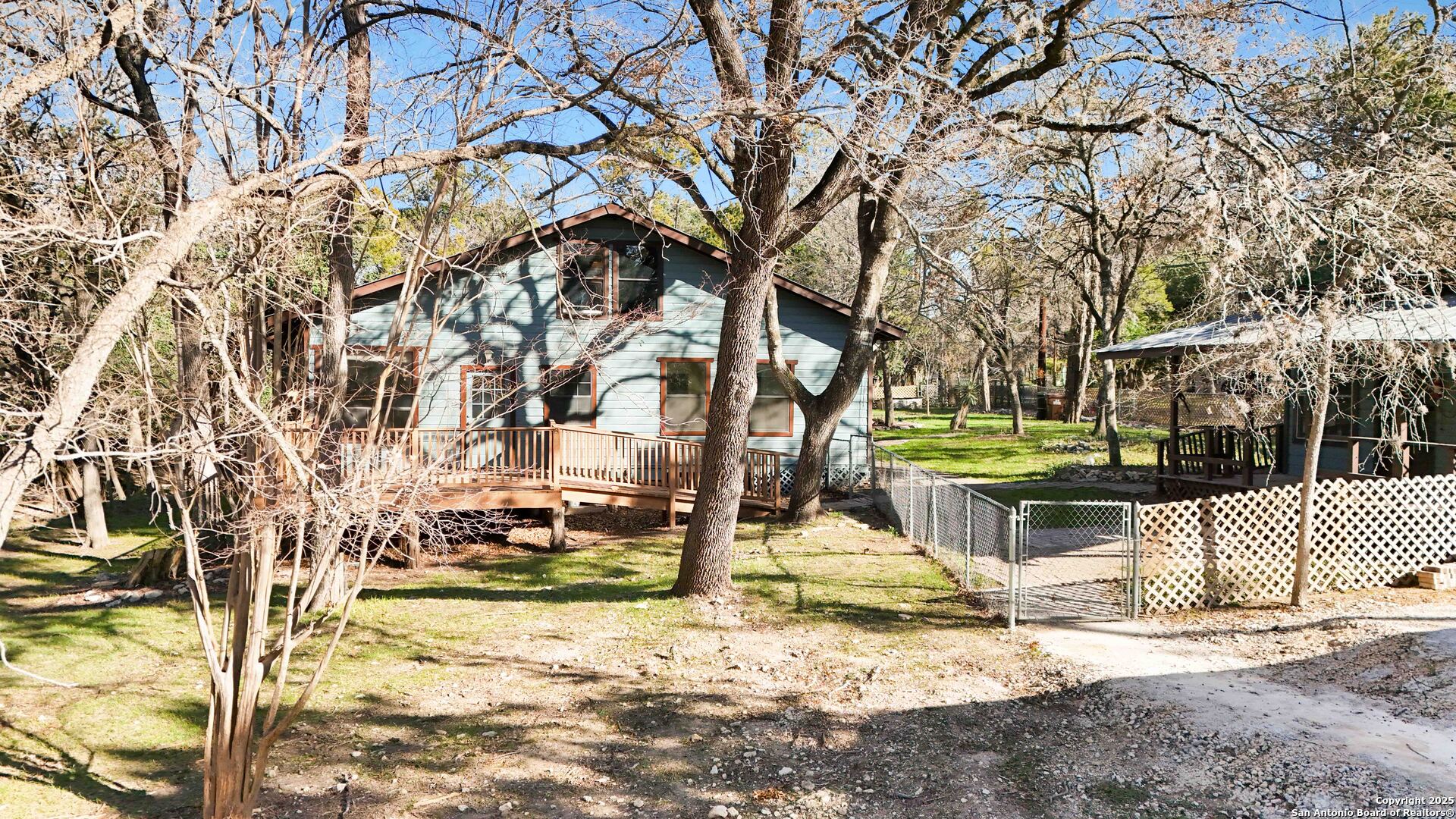 19517 Scenic Loop Road Helotes, TX 78023 - Photo 52 of 55 a view of a yard with a tree
