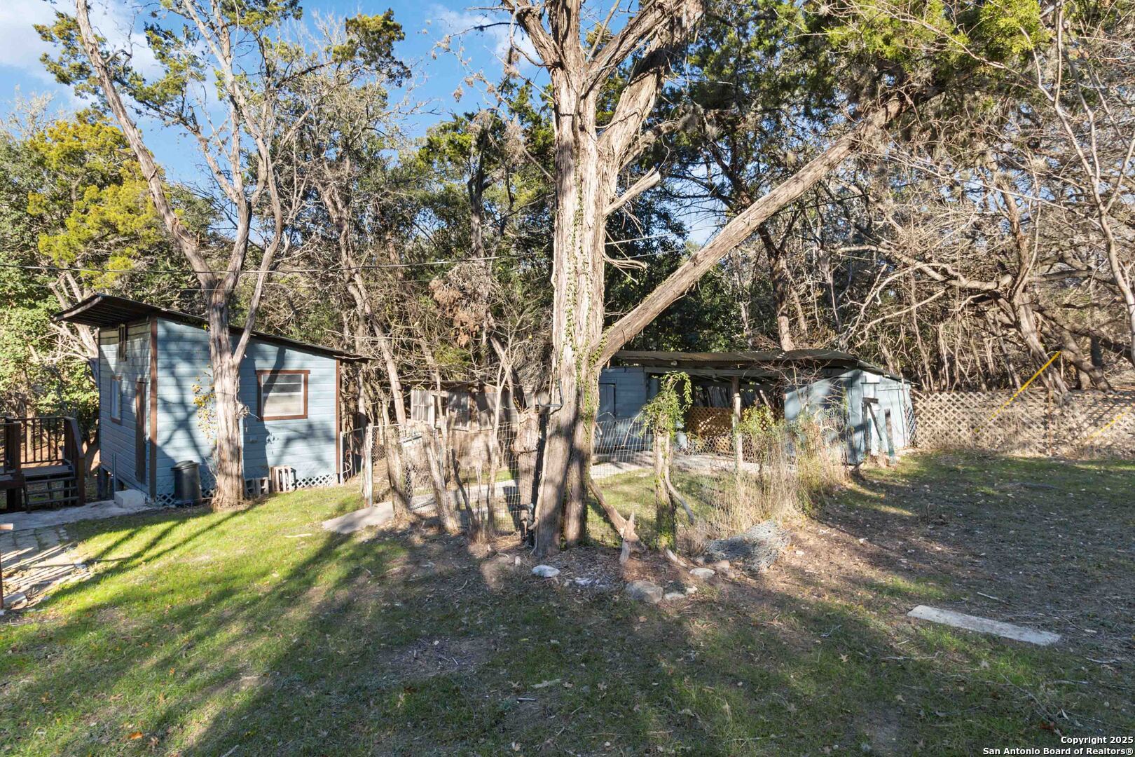 19517 Scenic Loop Road Helotes, TX 78023 - Photo 8 of 55 a view of swimming pool with a yard
