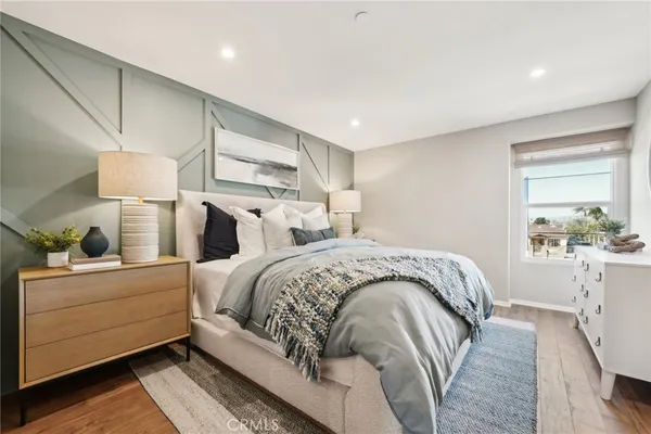 a bed room with a bed and a window