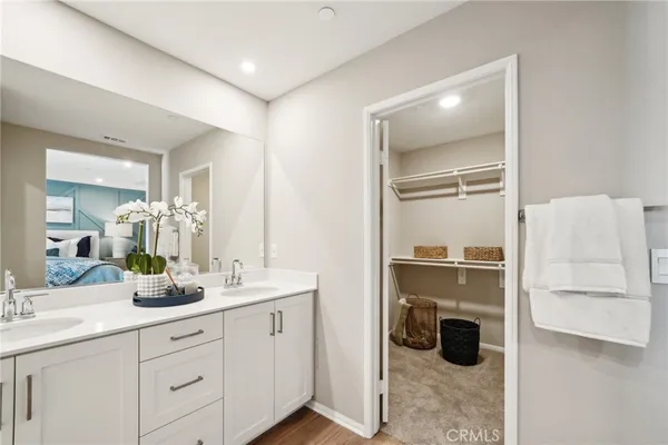 a bathroom with a double vanity sink and mirror