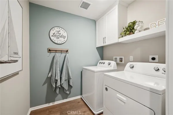 a view of storage and utility room with washer and dryer