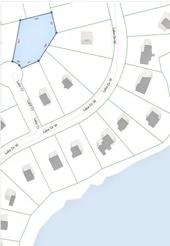 a white house with a street