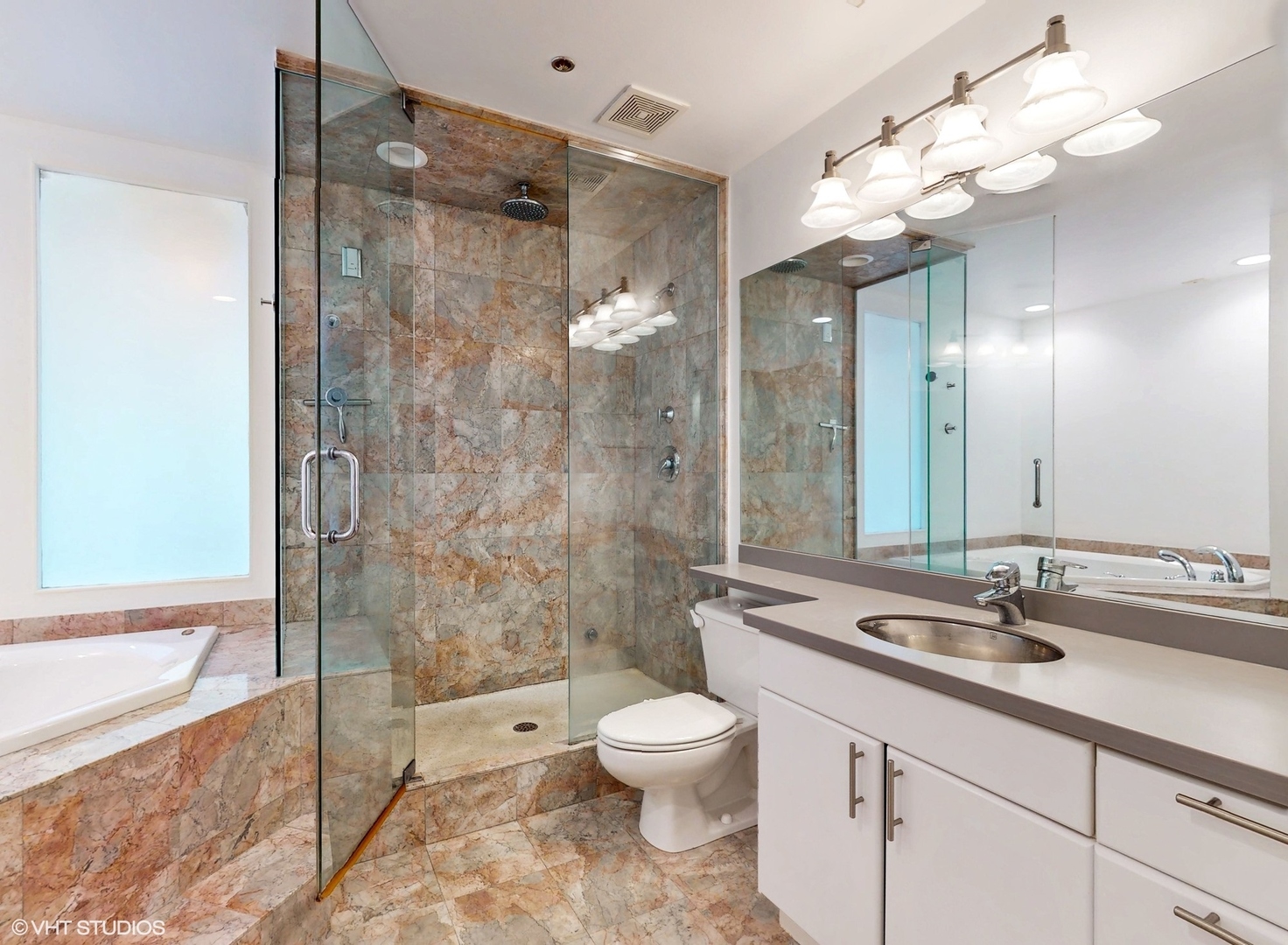 616 West Fulton Street, Unit 609 Chicago, IL 60661 - Photo 11 of 23 a bathroom with a toilet sink and shower