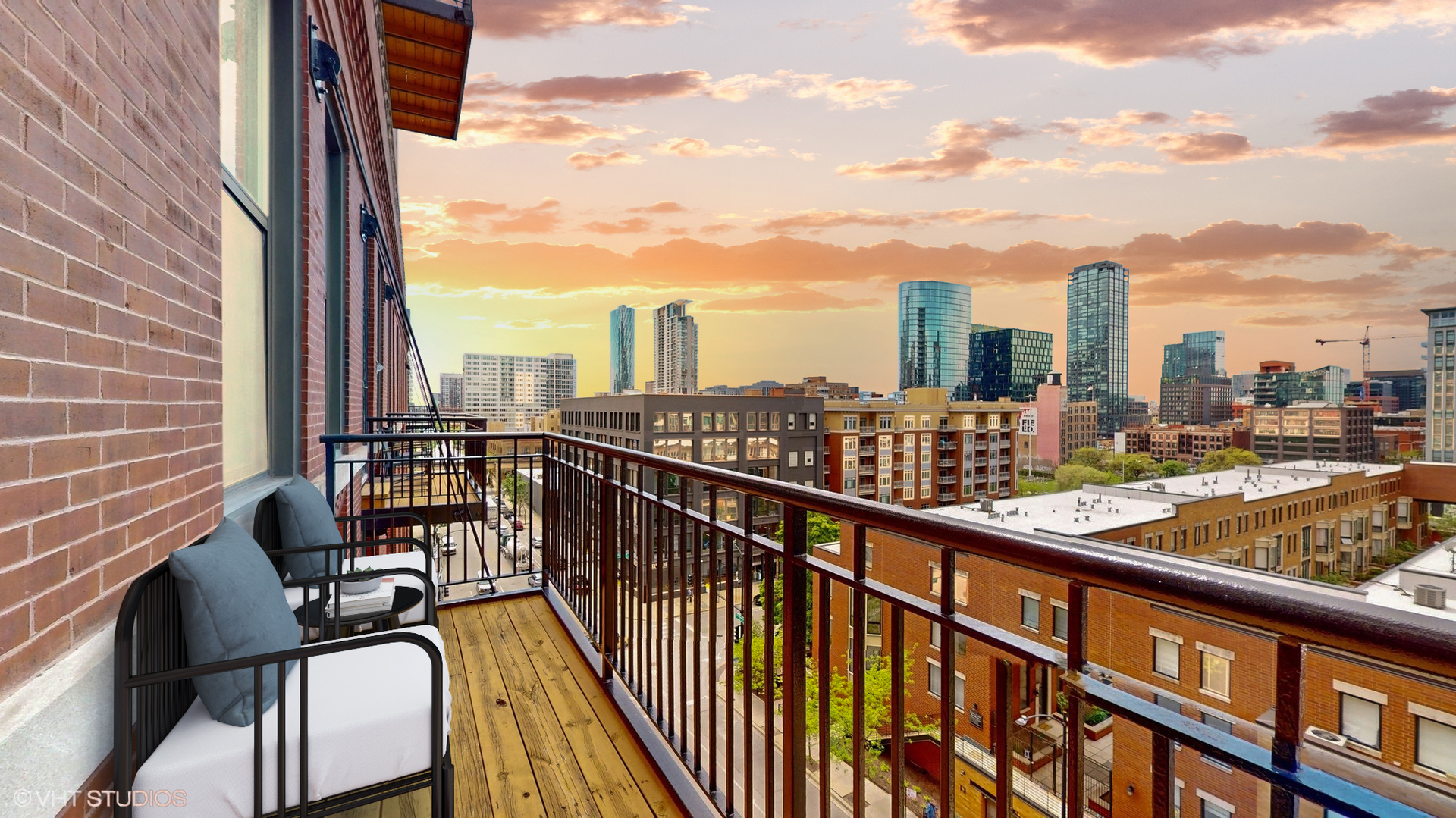 616 West Fulton Street, Unit 609 Chicago, IL 60661 - Photo 14 of 23 a view of a balcony with wooden chairs
