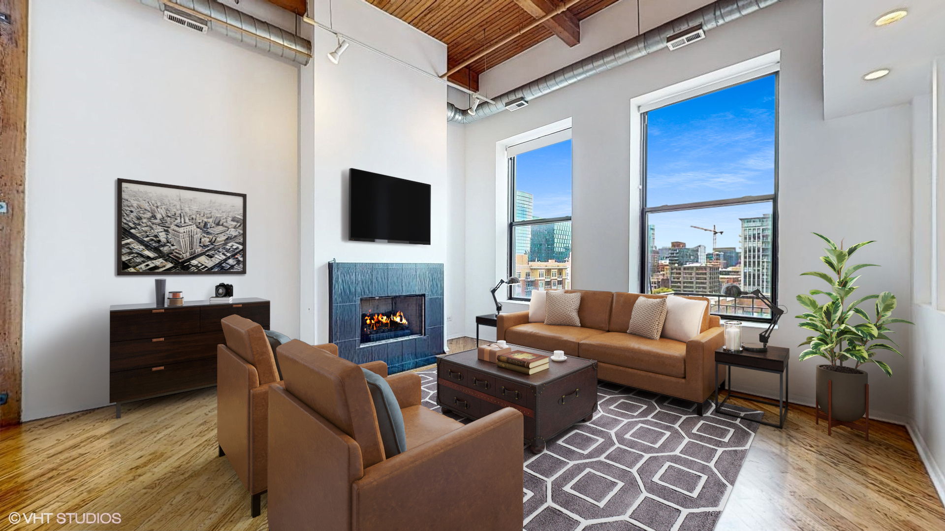 616 West Fulton Street, Unit 609 Chicago, IL 60661 - Photo 2 of 23 a living room with furniture a fireplace and a flat screen tv