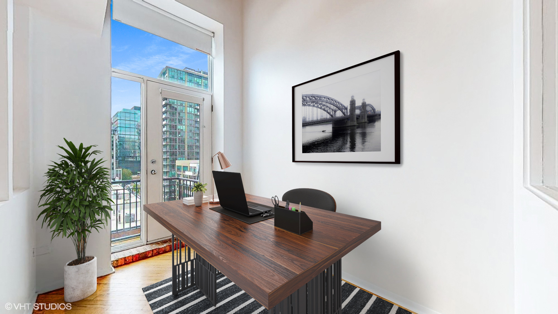 616 West Fulton Street, Unit 609 Chicago, IL 60661 - Photo 4 of 23 a view of a workspace with furniture and a potted plant