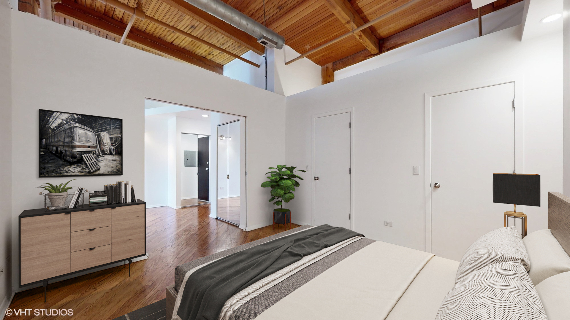 616 West Fulton Street, Unit 609 Chicago, IL 60661 - Photo 10 of 23 a bedroom with a bed and a flat screen tv