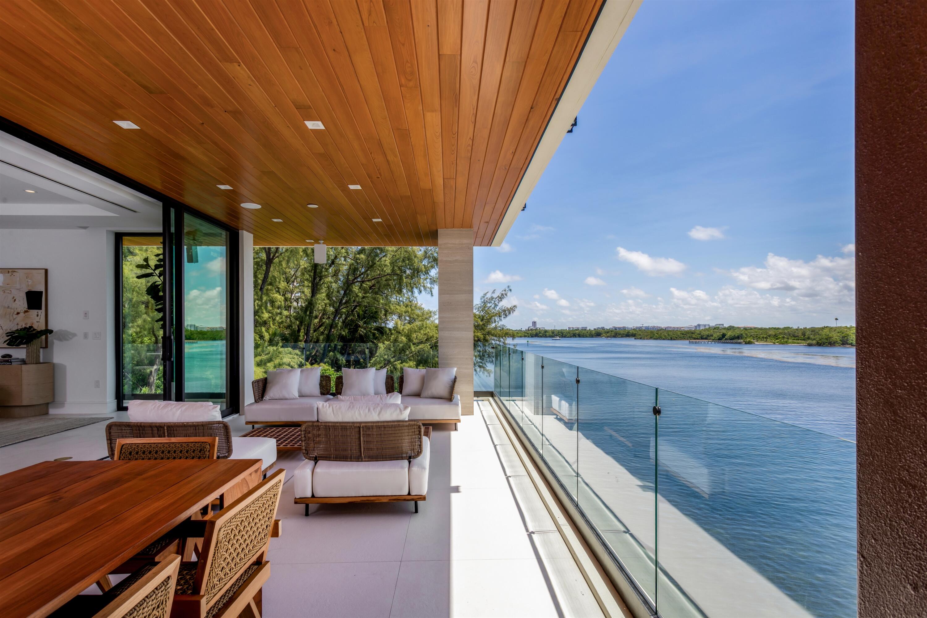 900 Lago Mar Lane, Unit PH Boca Raton, FL 33431 - Photo 33 of 58 a balcony with furniture and outdoor space