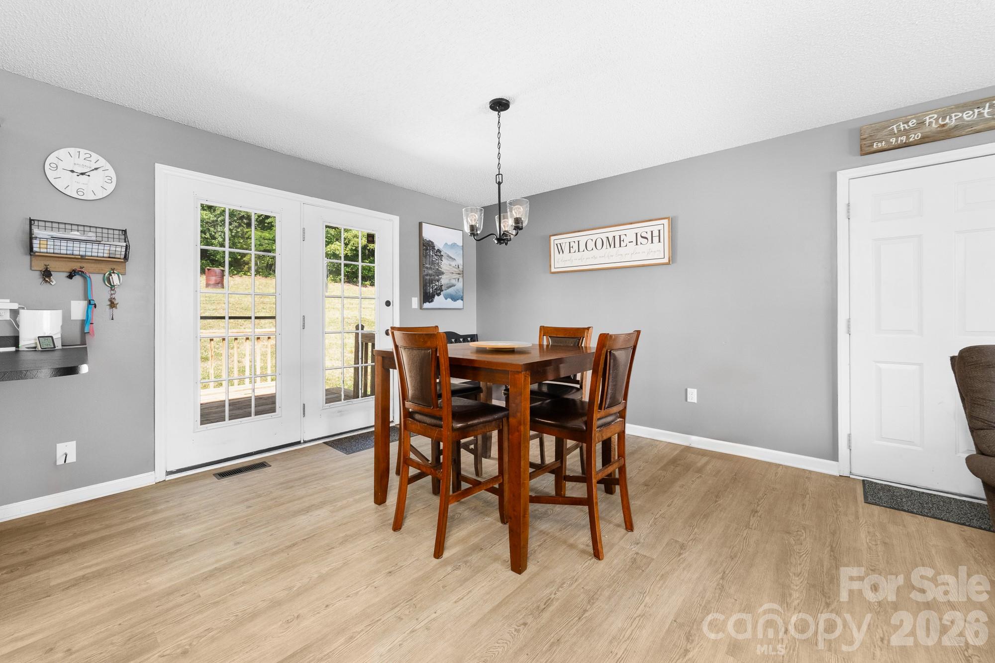 248 Jack McKinney Road Forest City, NC 28043 - Photo 19 of 29 a view of a dining room with furniture window and wooden floor