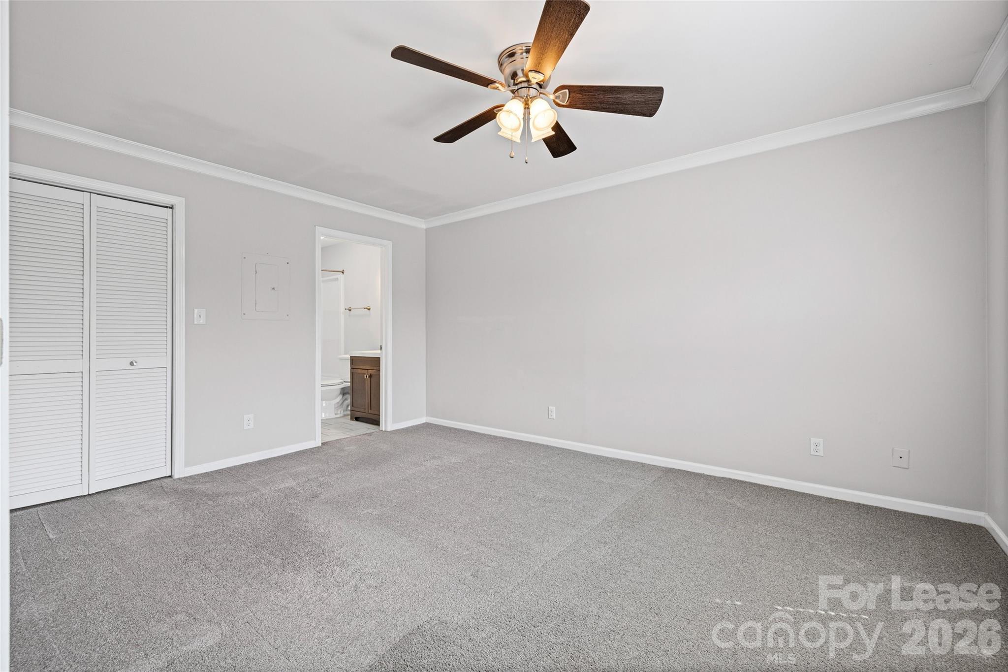 113 Stroupe Road, Unit E Gastonia, NC 28056 - Photo 17 of 33 an empty room with ceiling fan and window