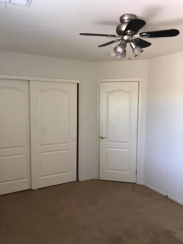 a view of a small space with a fan