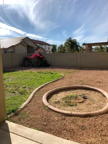a view of swimming pool with a yard