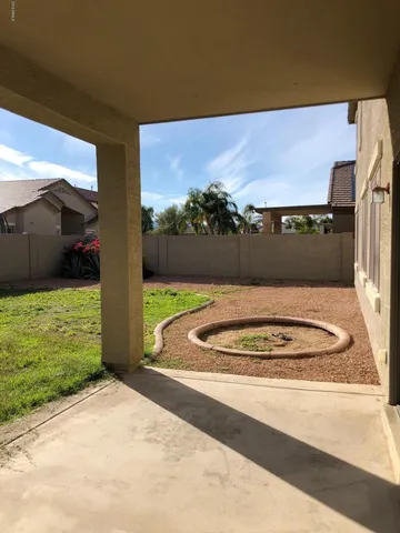 a view of a backyard of the house