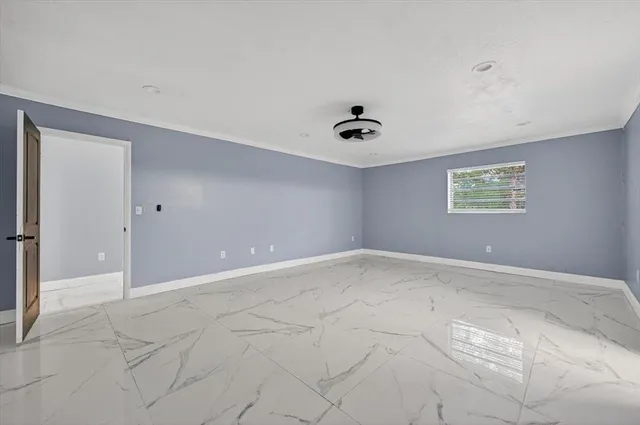 a view of an empty room with a fan