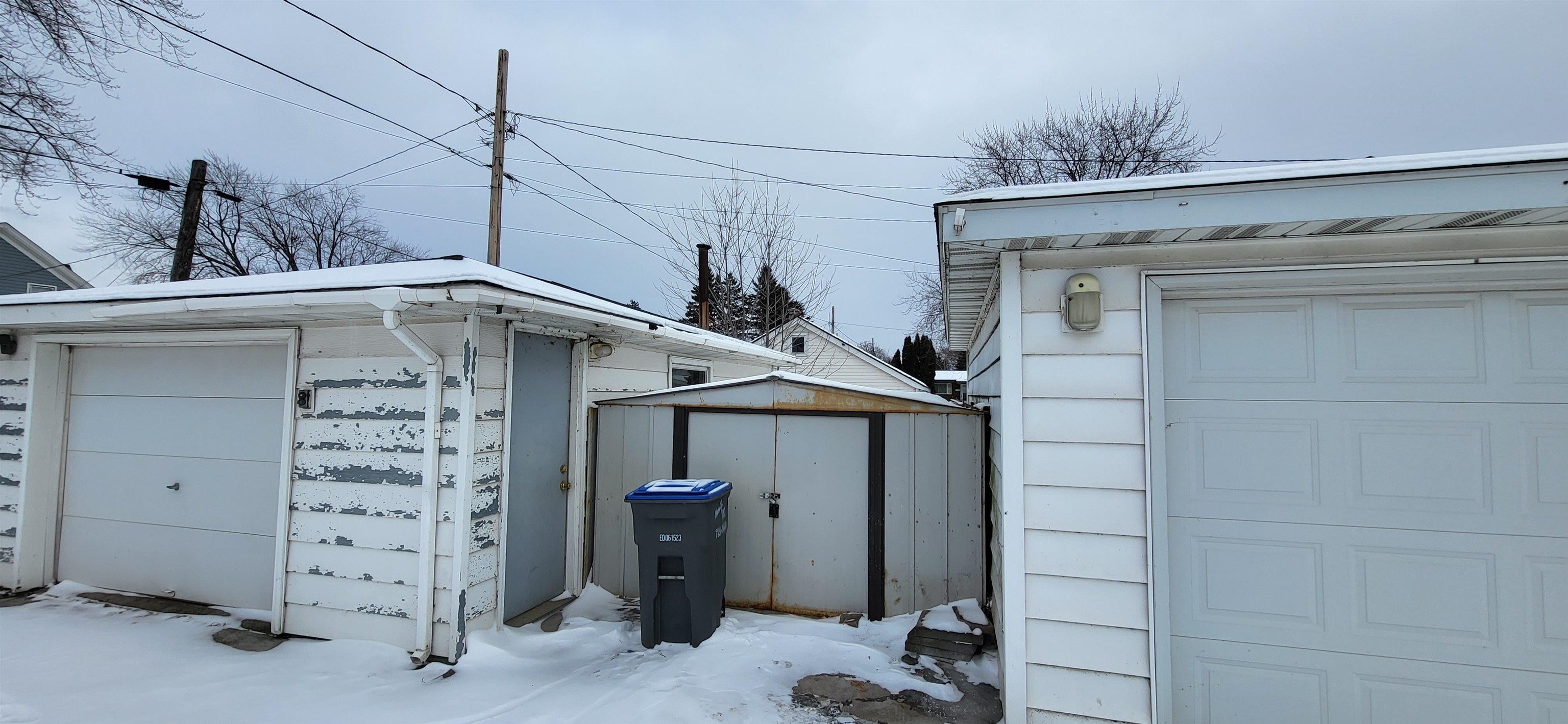 207 East 3rd Street Superior, WI 54880 - Photo 6 of 22 Garage featuring a shed