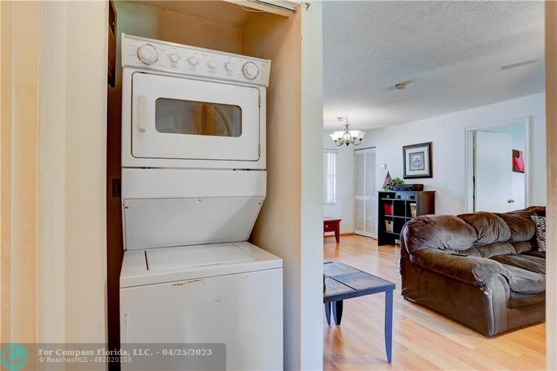 9649 Northwest 4th Street, Unit 5E Coral Springs, FL 33071 - Photo 15 of 30 a living room with furniture and a washer dryer