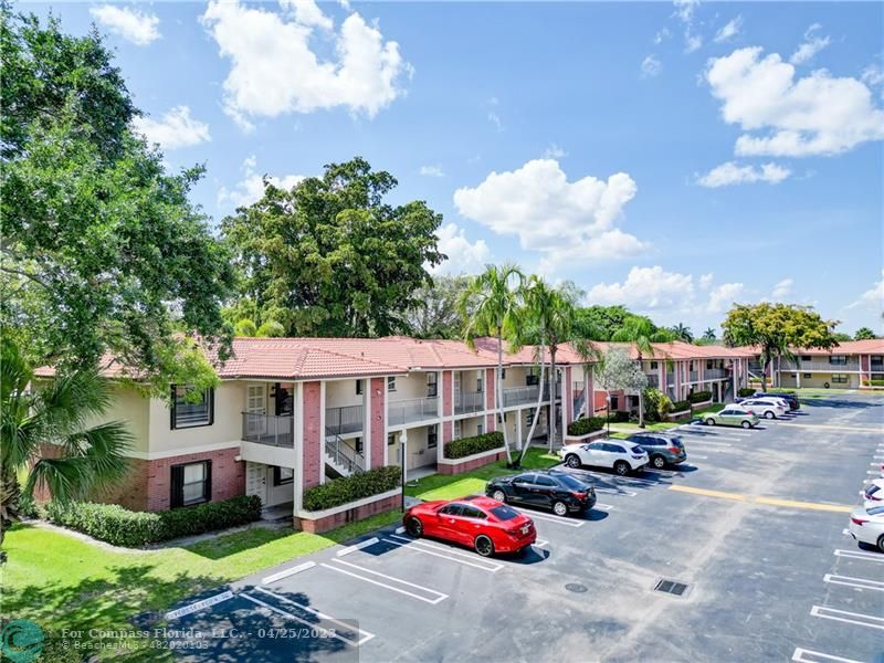 9649 Northwest 4th Street, Unit 5E Coral Springs, FL 33071 - Photo 18 of 30 a car parked in front of a house