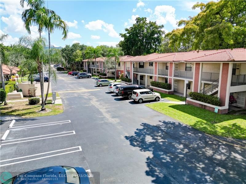 9649 Northwest 4th Street, Unit 5E Coral Springs, FL 33071 - Photo 20 of 30 a view of a house with sitting area and garden