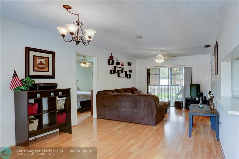 9649 Northwest 4th Street, Unit 5E Coral Springs, FL 33071 - Photo 2 of 30 a living room with furniture and wooden floor