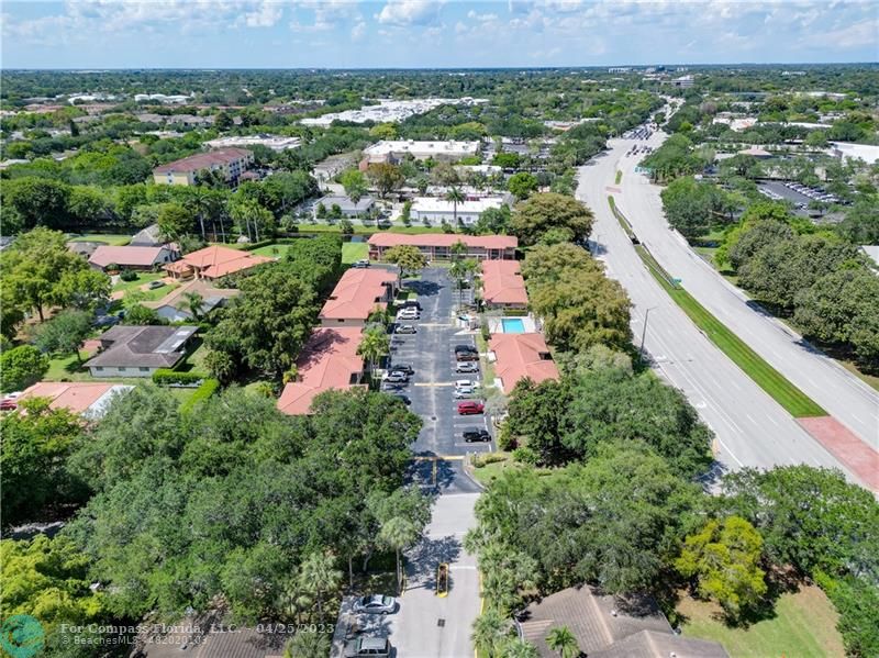 9649 Northwest 4th Street, Unit 5E Coral Springs, FL 33071 - Photo 24 of 30 an aerial view of residential houses with outdoor space and trees