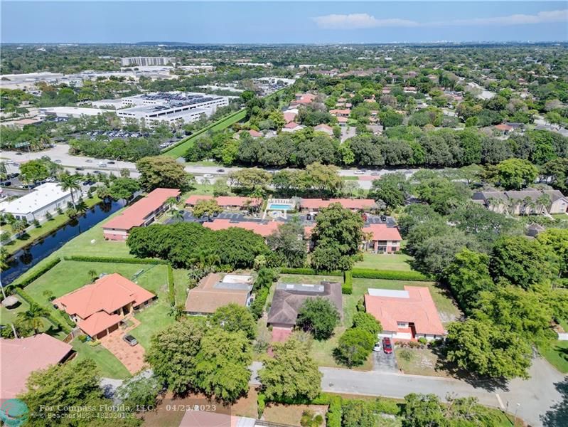 9649 Northwest 4th Street, Unit 5E Coral Springs, FL 33071 - Photo 25 of 30 an aerial view of residential houses with outdoor space and street view