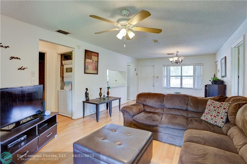 9649 Northwest 4th Street, Unit 5E Coral Springs, FL 33071 - Photo 4 of 30 a living room with furniture a ceiling fan and a window