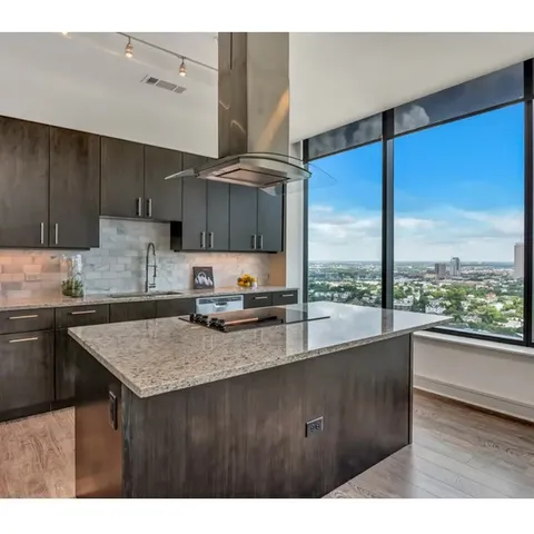 a kitchen with a sink a counter top space and appliances