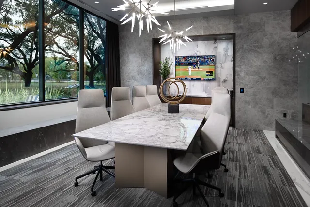 a dining room with furniture and wooden floor