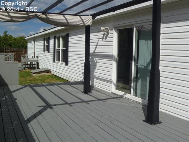 4535 Evans Road Monument, CO 80132 - Photo 20 of 23 Back deck access from the family room
