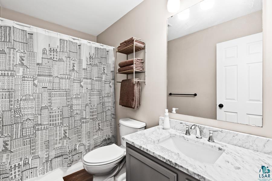 2020 East 11th Street Superior, WI 54880 - Photo 11 of 30 Bathroom featuring vanity and curtained shower