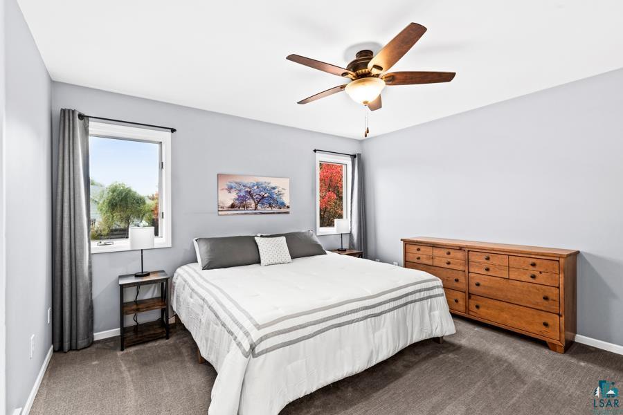 2020 East 11th Street Superior, WI 54880 - Photo 12 of 30 Bedroom with dark colored carpet and ceiling fan
