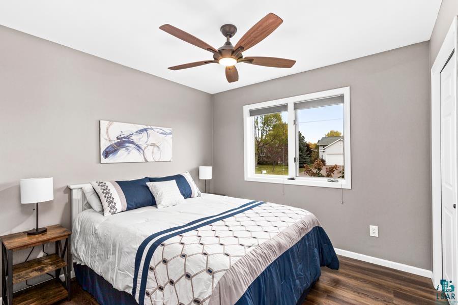 2020 East 11th Street Superior, WI 54880 - Photo 15 of 30 Bedroom featuring dark wood finished floors, a closet, and ceiling fan