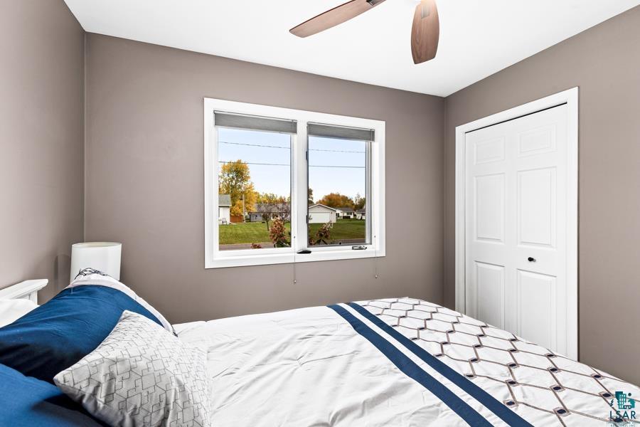 2020 East 11th Street Superior, WI 54880 - Photo 16 of 30 Bedroom featuring ceiling fan and a closet