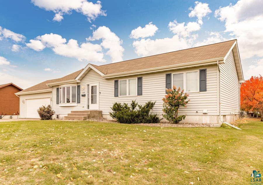 2020 East 11th Street Superior, WI 54880 - Photo 2 of 30 Ranch-style house featuring a front yard and an attached garage