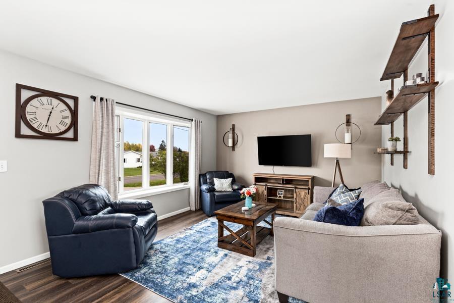 2020 East 11th Street Superior, WI 54880 - Photo 5 of 30 Living area with wood finished floors and baseboards