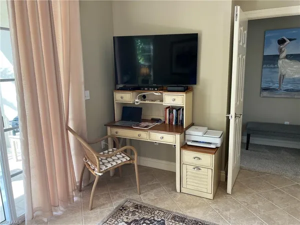 a room with furniture and a flat screen tv