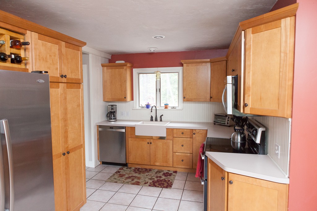 235 Ellis Road Westminster, MA 01473 - Photo 7 of 30 a kitchen with a sink a stove top oven and cabinets
