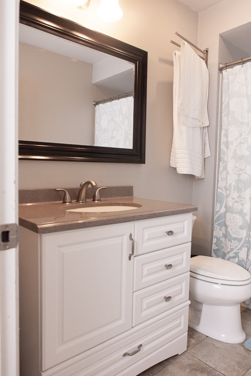 235 Ellis Road Westminster, MA 01473 - Photo 8 of 30 a bathroom with a granite countertop toilet sink and mirror