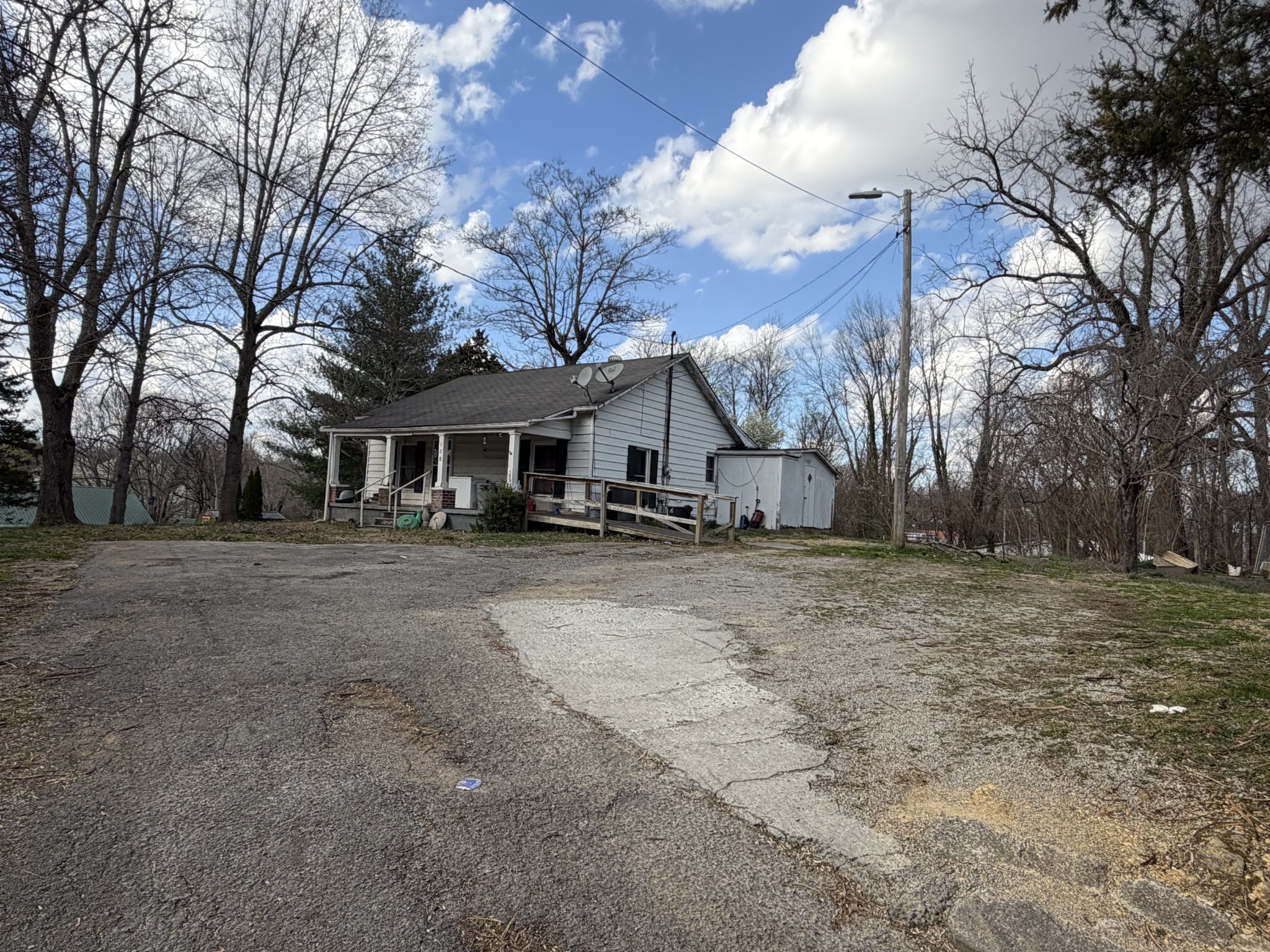 128 West Shellsford Road McMinnville, TN 37110 - Photo 2 of 4 a view of a house with a yard covered in snow