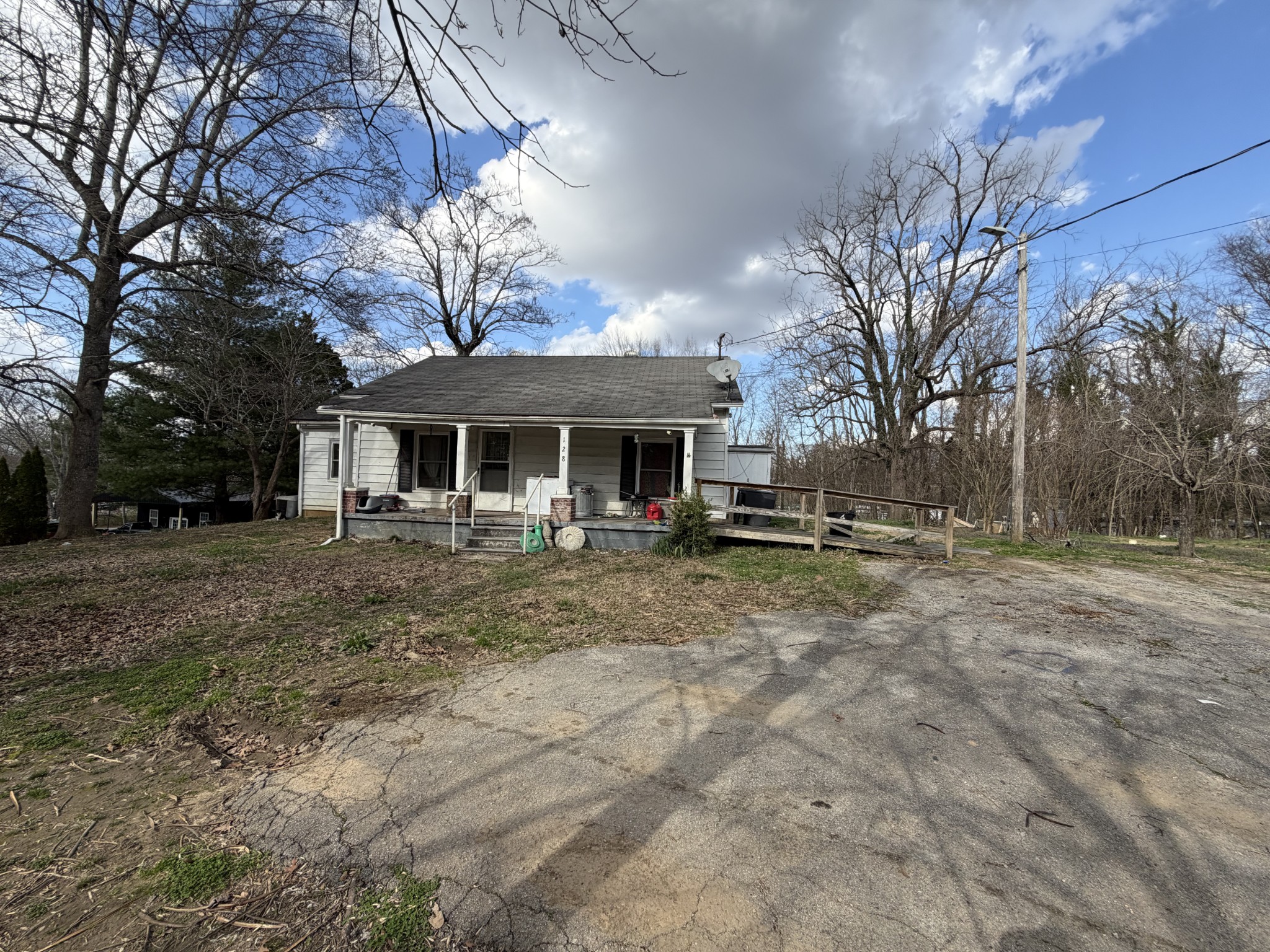 128 West Shellsford Road McMinnville, TN 37110 - Photo 4 of 4 a view of a house with a yard and large tree