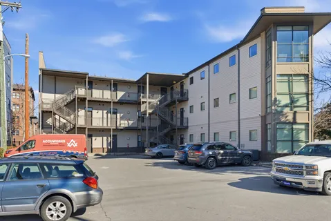 a car parked in front of a building