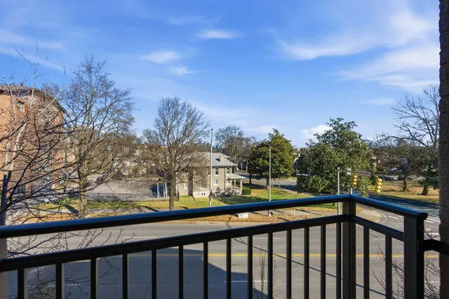 a view of a street from a balcony