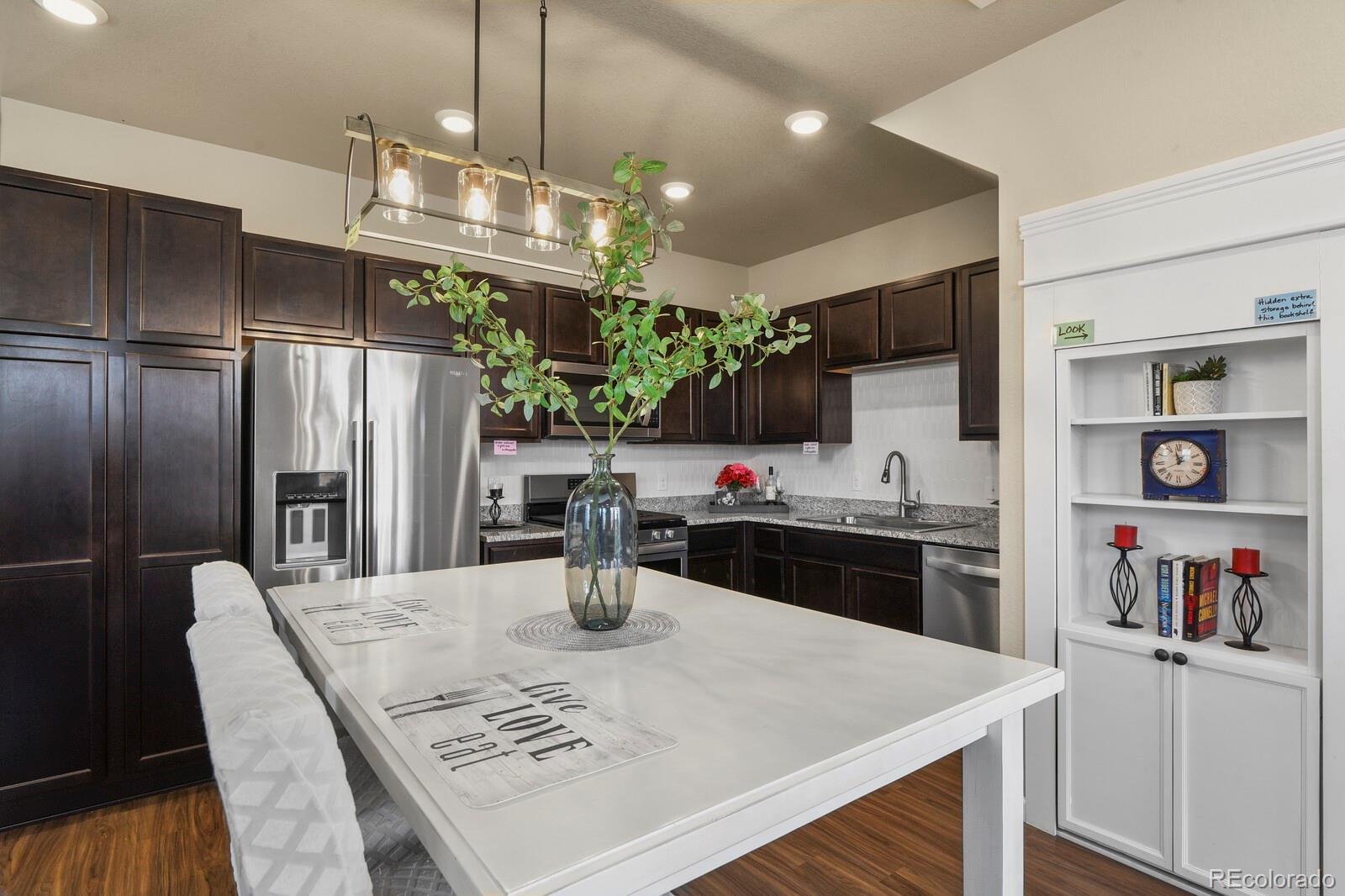 1078 Oak Circle Denver, CO 80215 - Photo 11 of 29 a kitchen with a table and chairs in it