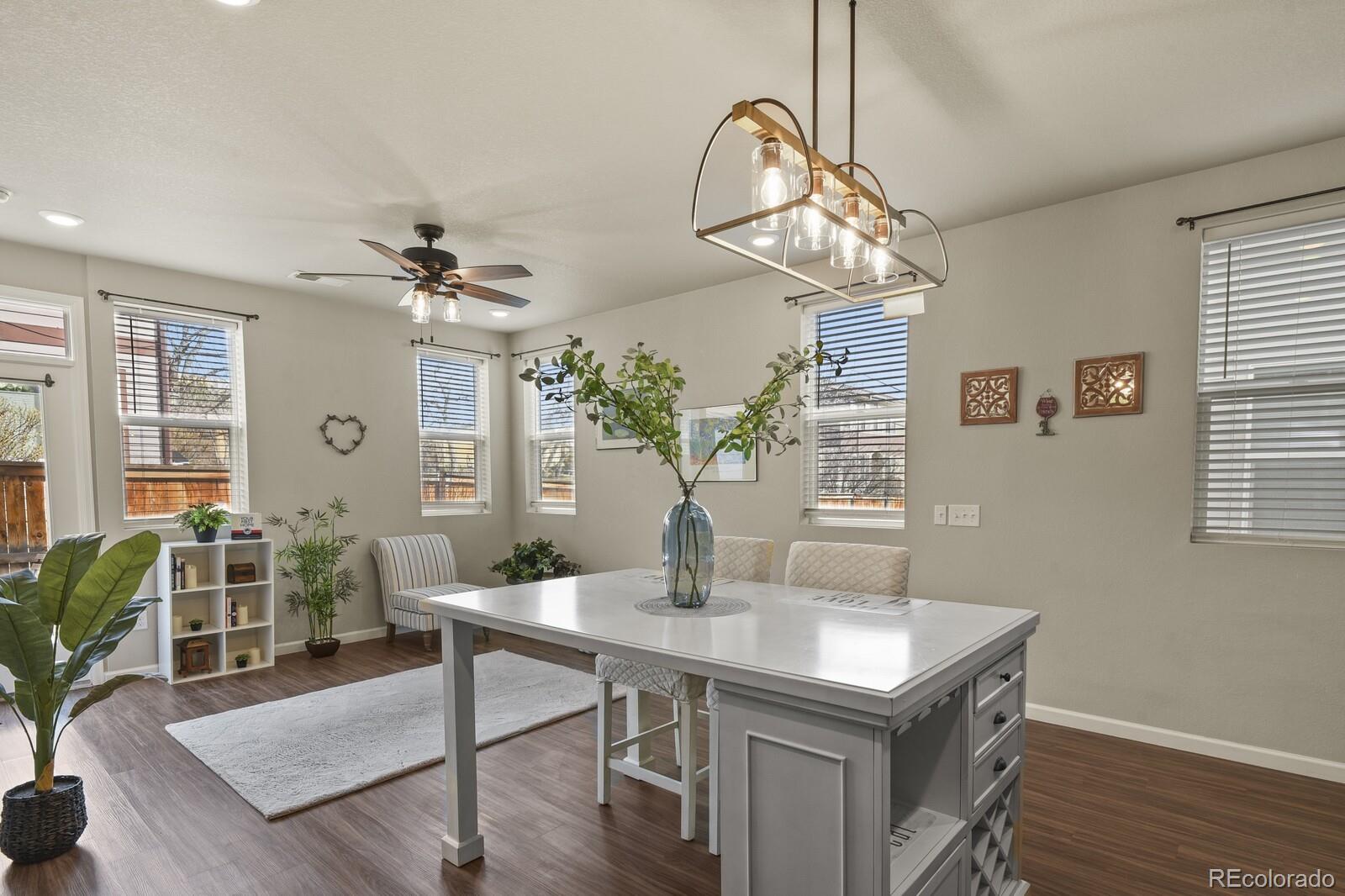 1078 Oak Circle Denver, CO 80215 - Photo 13 of 29 a view of a dining room with furniture window and wooden floor