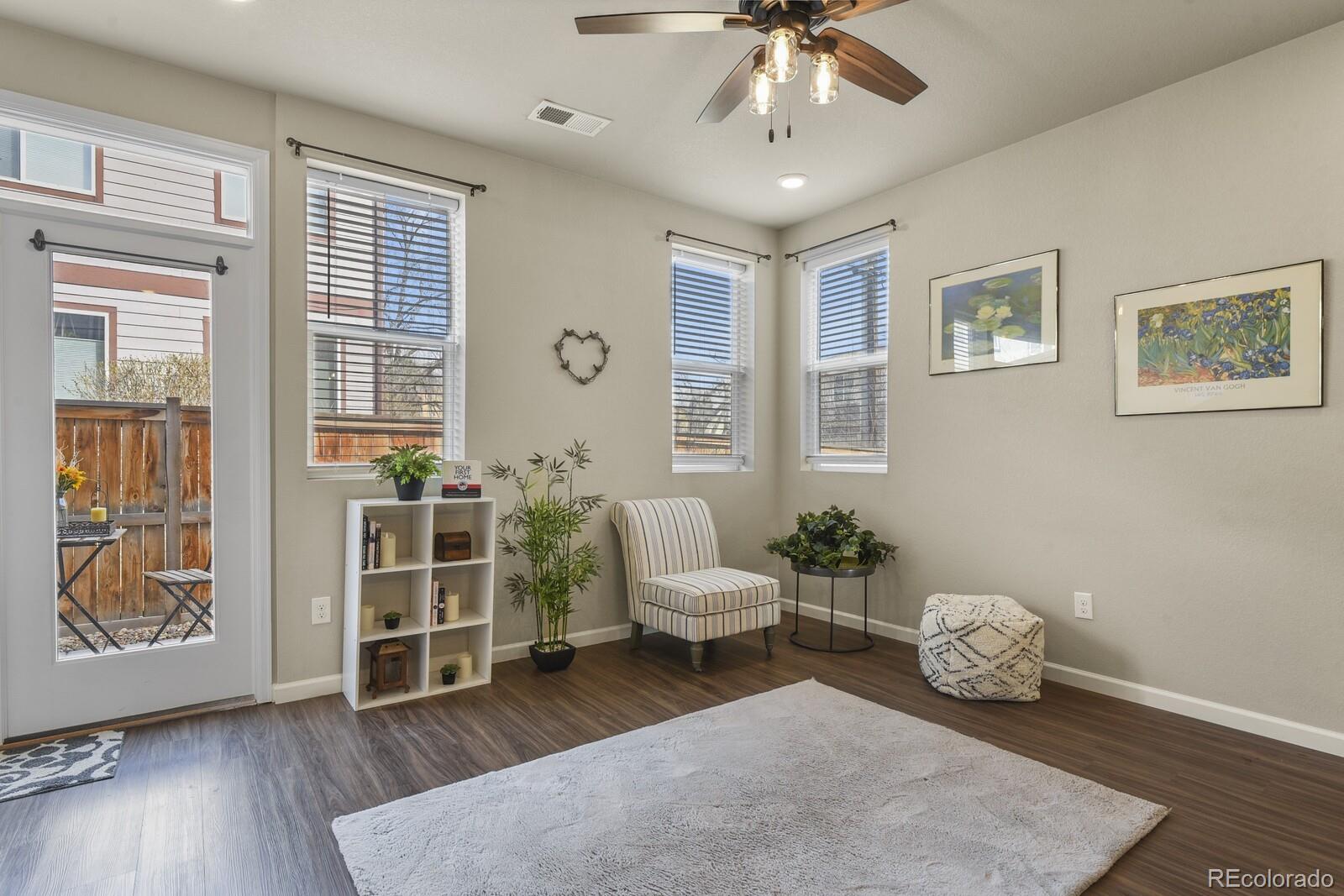 1078 Oak Circle Denver, CO 80215 - Photo 14 of 29 a living room with furniture and wooden floor